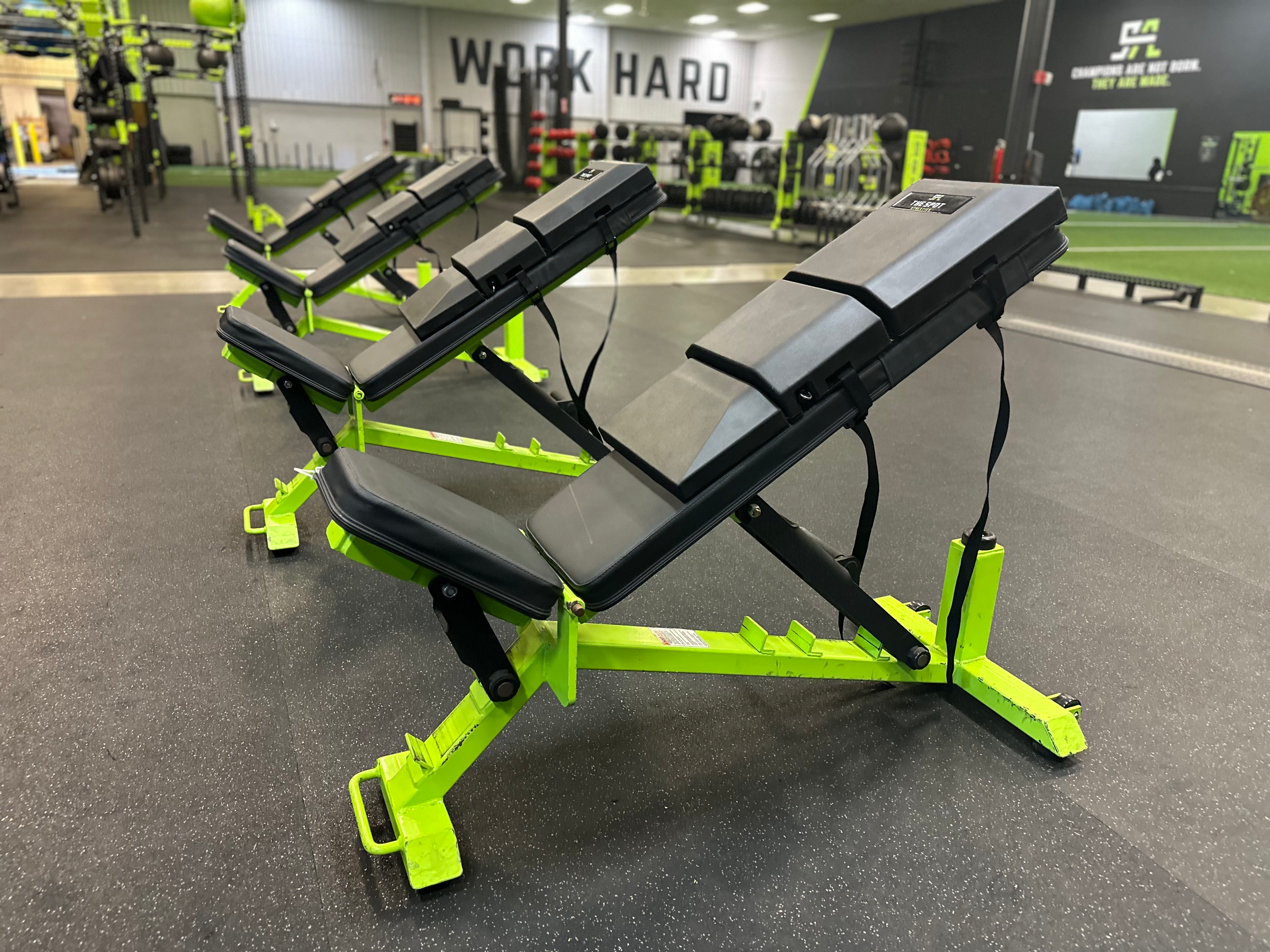 Advanced Muscle Mechanics Launch Pads on adjustable benches in incline position at The Spot Athletics, enhancing workouts for athletes.