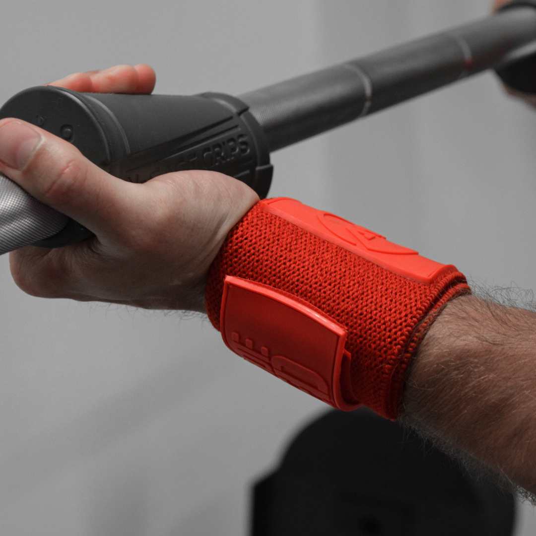 Close-up of Advanced Muscle Mechanics Code Red Premium Wrist Wraps providing firm wrist support during a barbell curl, enhancing stability and reducing strain during lifts.