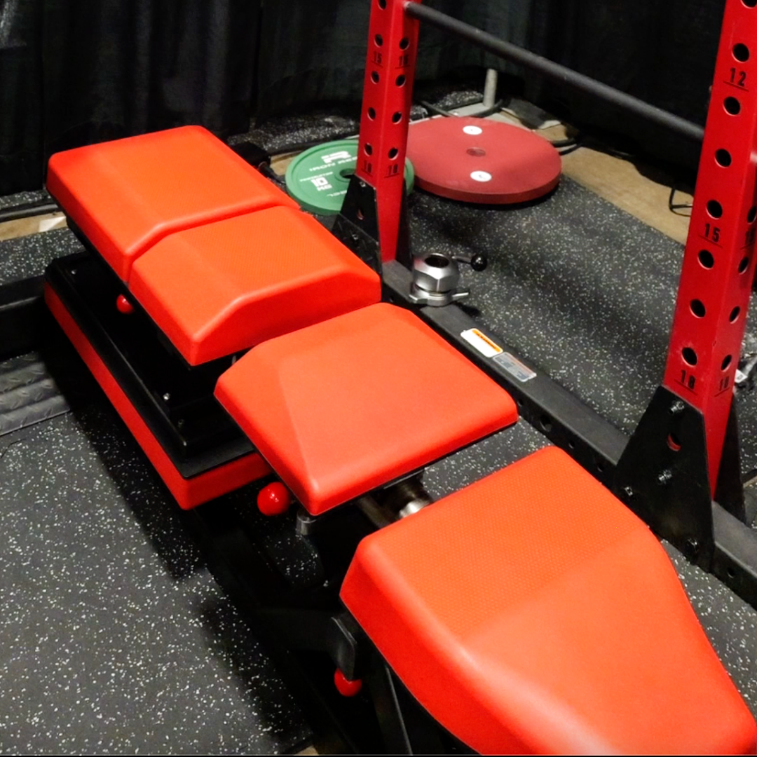 User performing flat dumbbell pressing on the contoured performance surface of the current Joint Ops prototype