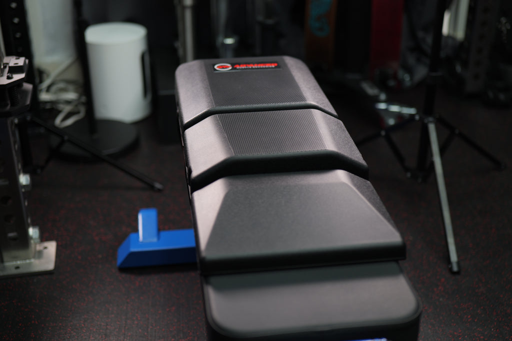 Front view of Launch Pad Gen II on flat bench improving grip alignment, bar path control, and upper body stability.