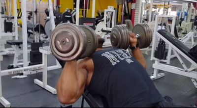 Former NFL running back Javon Ringer using The Launch Pad™ for incline dumbbell press, enhancing range of motion and muscle engagement.