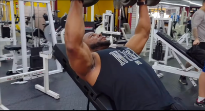 Former NFL running back Javon Ringer using The Launch Pad™ for incline dumbbell press, maximizing range of motion and muscle engagement.